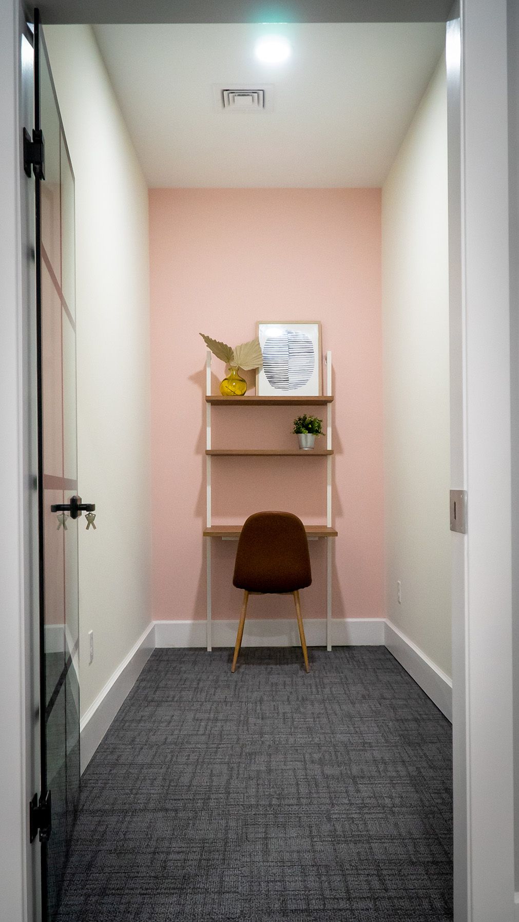 Offcie space in Rebel HQ featuring soft pink wall color and modern décor